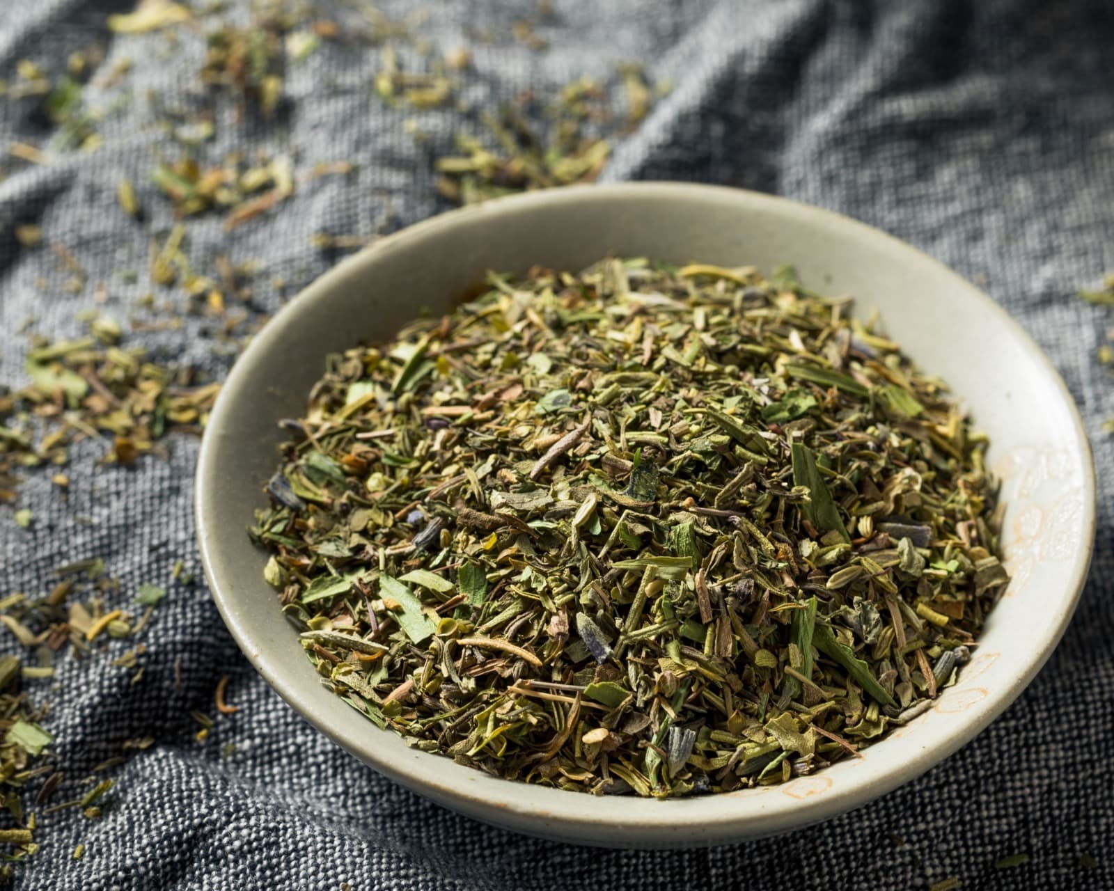 Dried kitchen herb blend in a small jar or bowl.