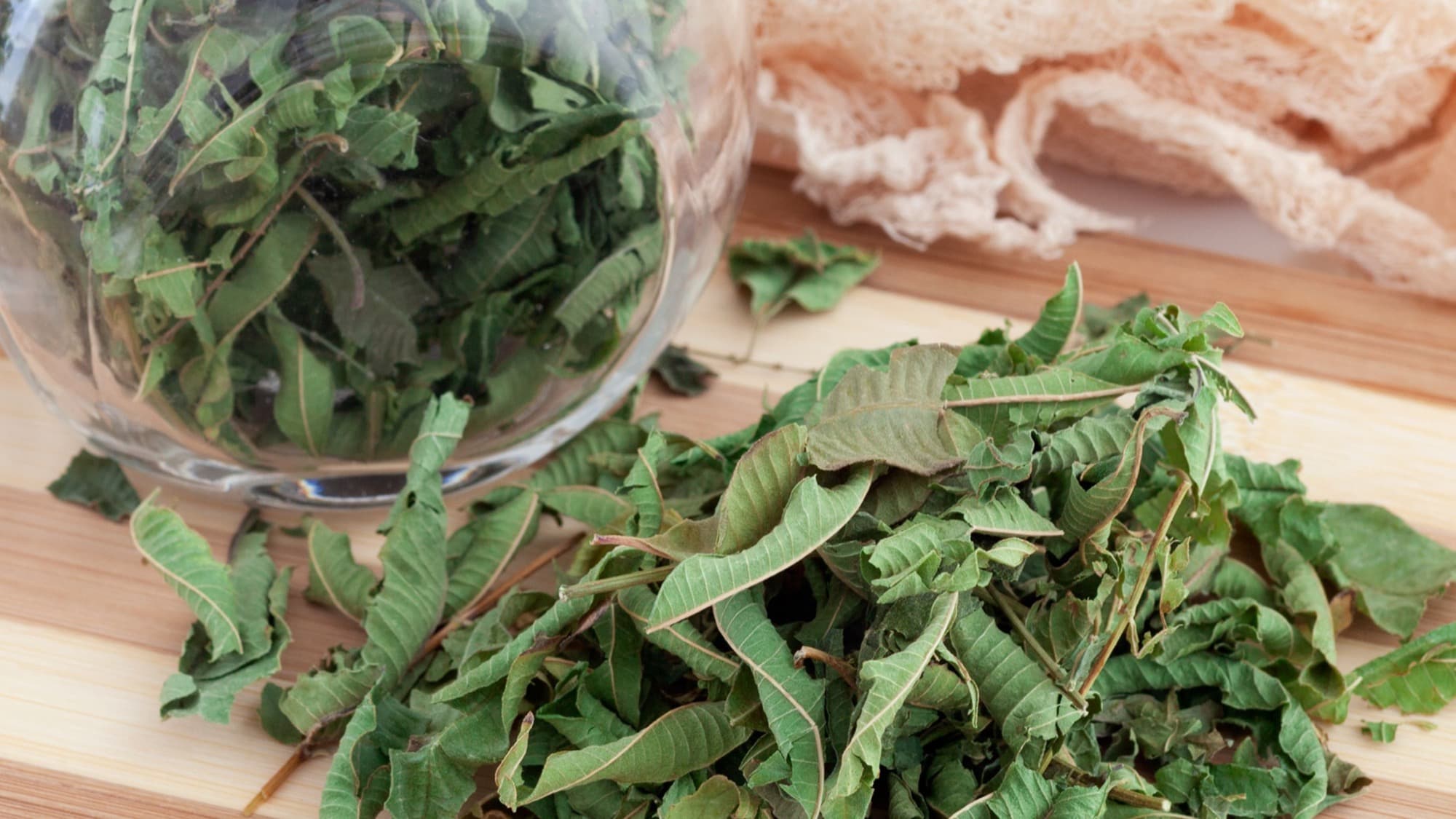 Dried homegrown tea herbs being blended for tea.